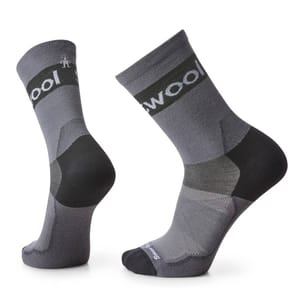 A pair of gray wool socks with reinforced heel and toe areas, designed for comfort and durability.