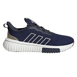 A navy and beige athletic shoe featuring a textured upper, distinctive striped design on the side, and a ribbed white sole with a black traction pad.