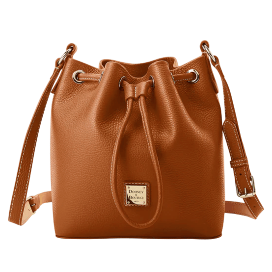 Brown leather bucket bag with a drawstring closure, adjustable strap, and a small logo patch on the front.