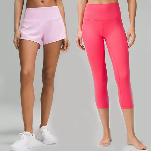 Two women showcasing light pink shorts and bright pink capri leggings, both paired with white sneakers.