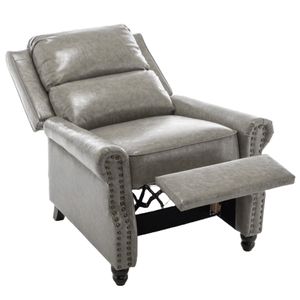 A gray leather recliner chair with nailhead trim and a raised footrest, featuring padded armrests and a cushioned back, on short wooden legs.