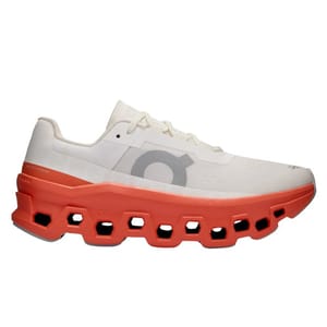 The On CloudMonster Running Shoes feature a unique design with a cushioned, orange sole having hexagonal cutouts and a white mesh upper, complemented by a large logo on the side.