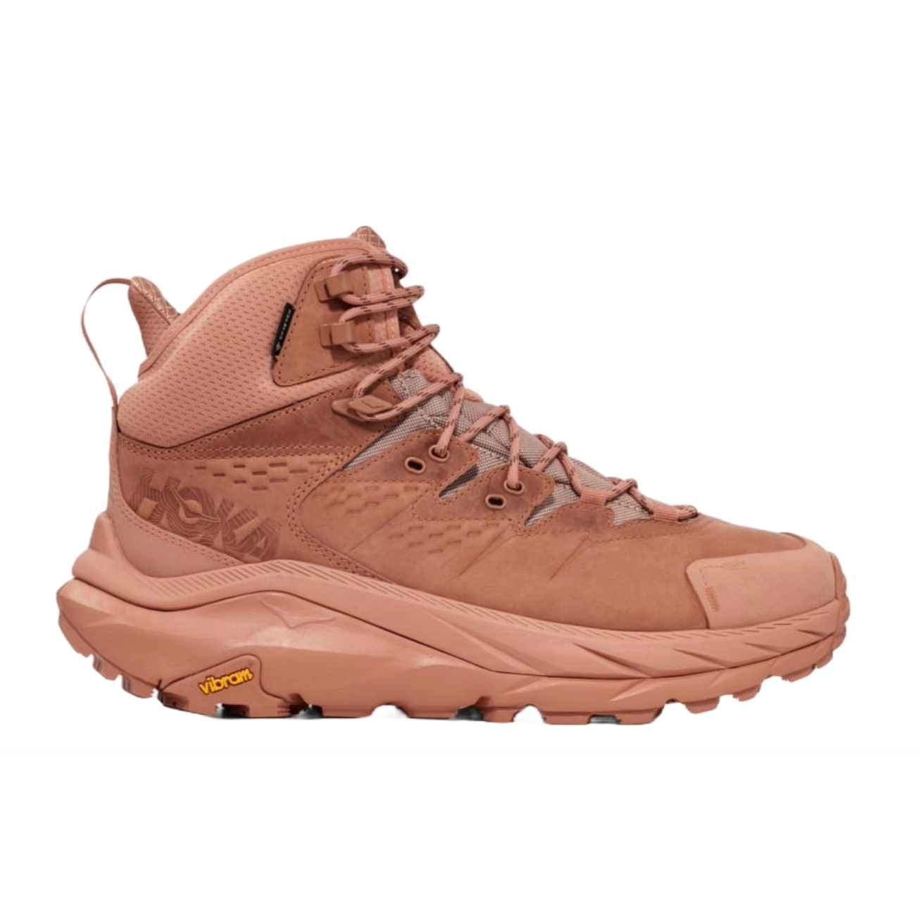 Hiking boot in a muted pink color, featuring a high-top design with laces, a cushioned sole, and a distinctive Vibram logo on the tread.