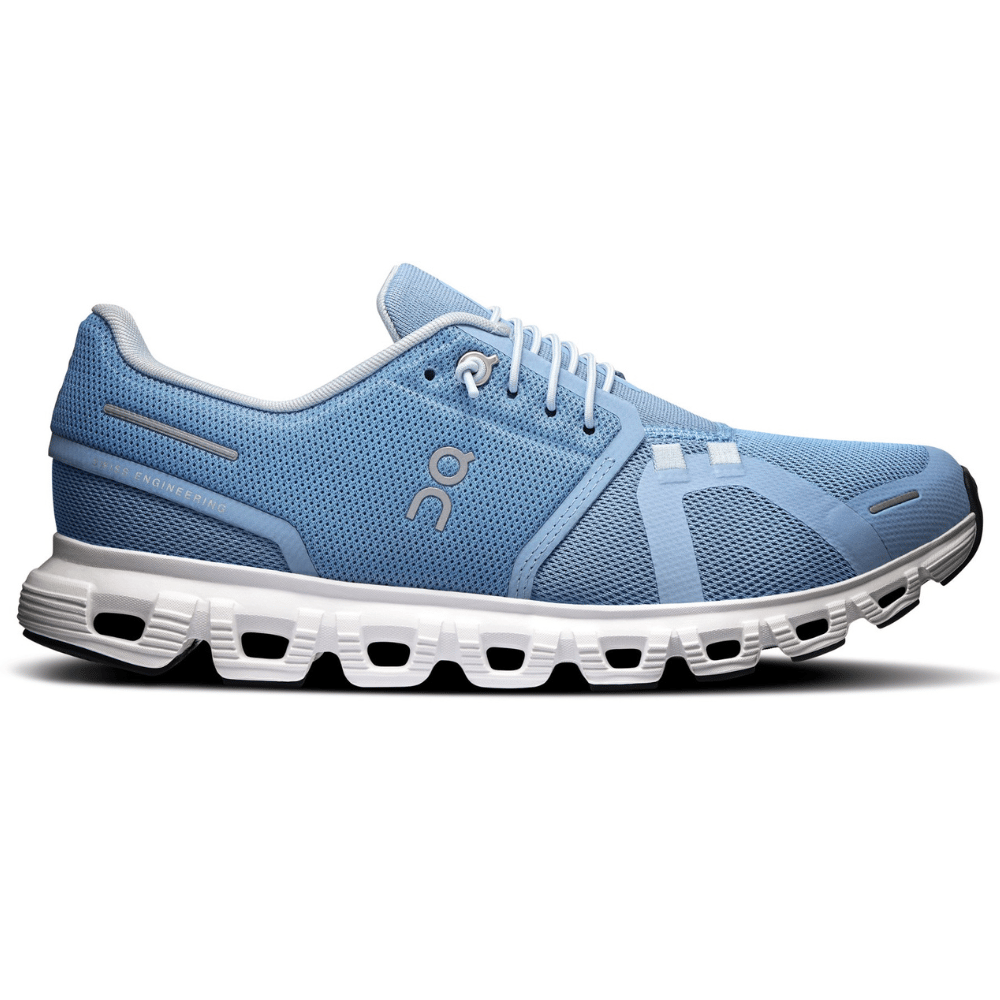Light blue athletic shoe with a white cushioned sole featuring a unique hollow construction for enhanced comfort and support.