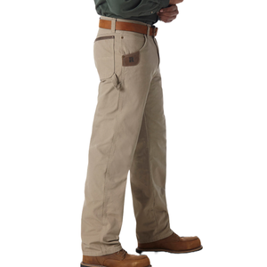 A person wearing khaki work pants with a leather belt and brown boots, featuring a small tool pocket on the side.