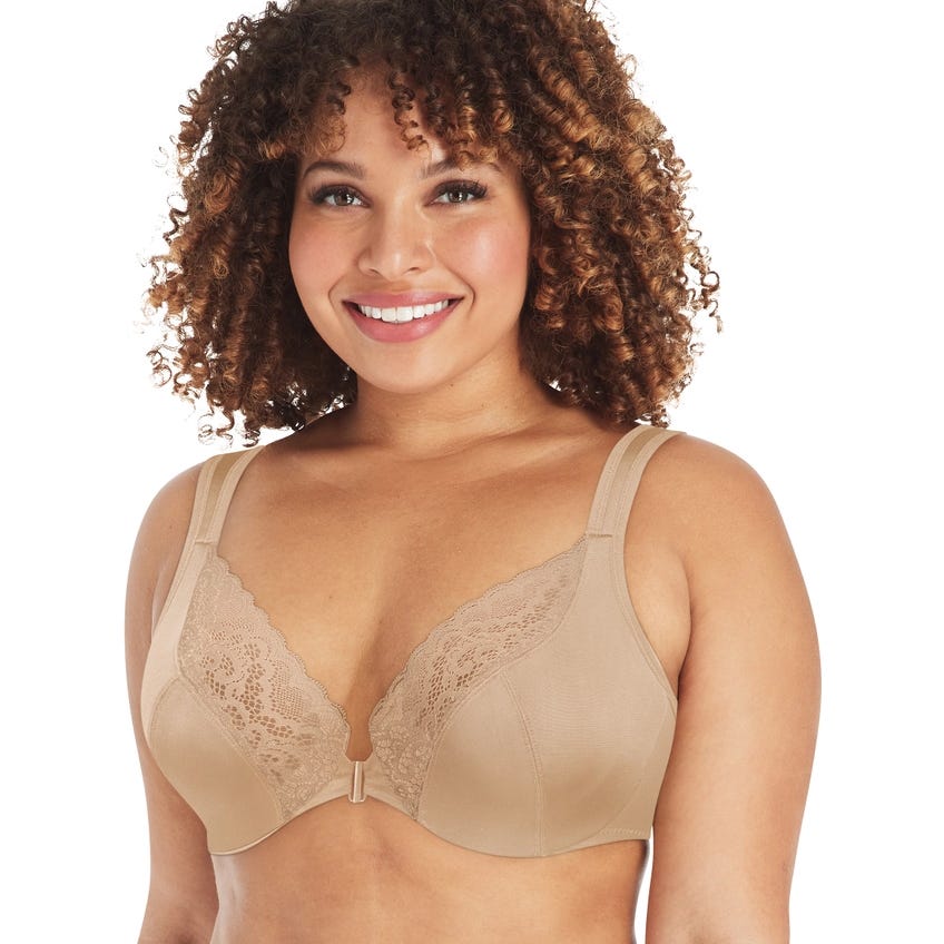 A woman is wearing a beige bra with lace detailing from One Hanes Place. The bra features adjustable straps and a front closure, representing the variety available in the Clearance section for comfort and style.