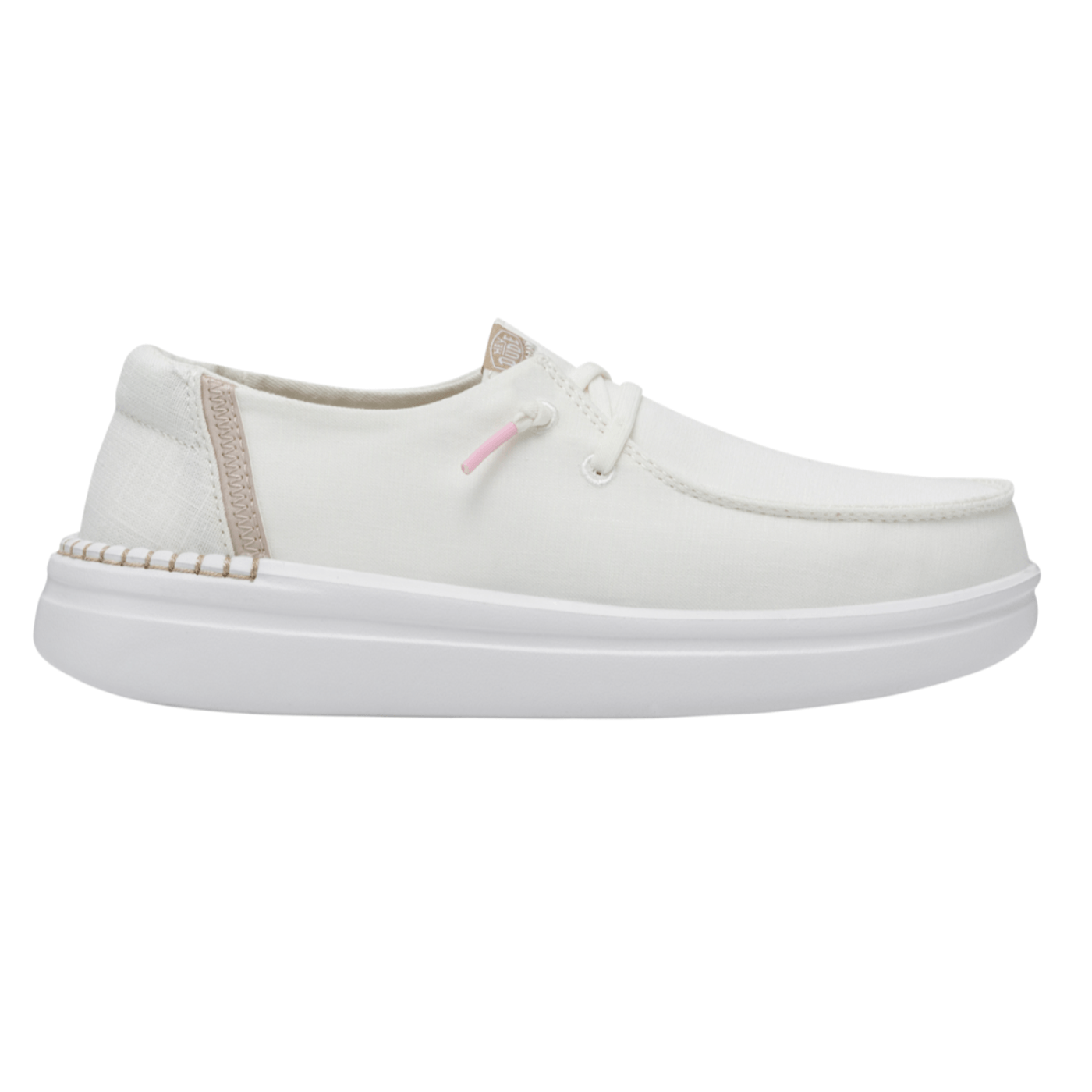 A white casual loafer with a low-profile sole, featuring light pink accents on the lace tips and beige detailing on the heel.