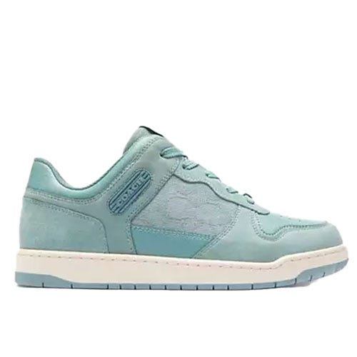 Light blue low-top sneakers with a textured panel design, lace-up front, and a white sole. Features include subtle branding on the side and a cushioned sole for comfort.