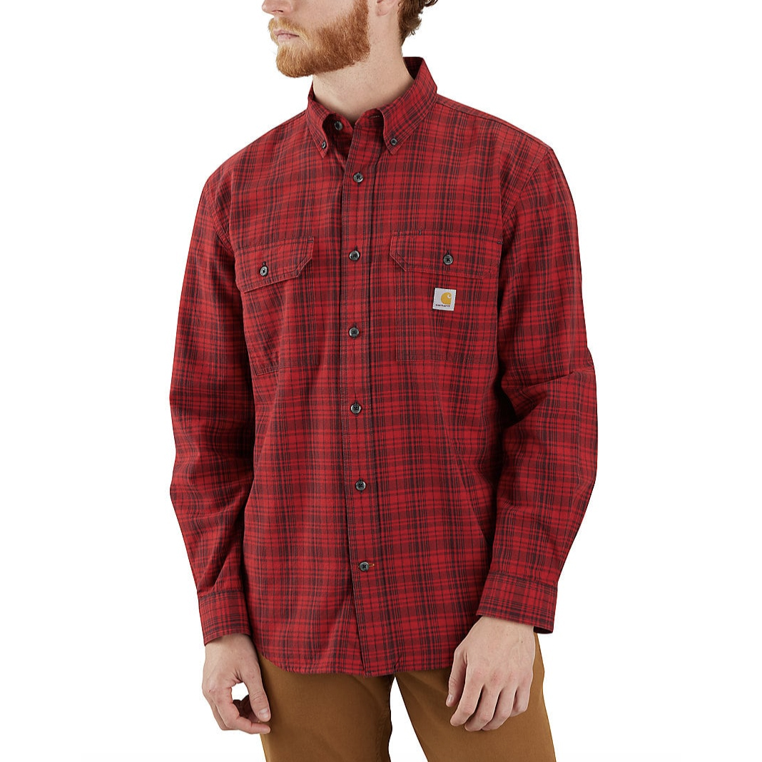 Red and black plaid button-up shirt with dual chest pockets and buttoned cuffs, featuring the Carhartt logo on one pocket.