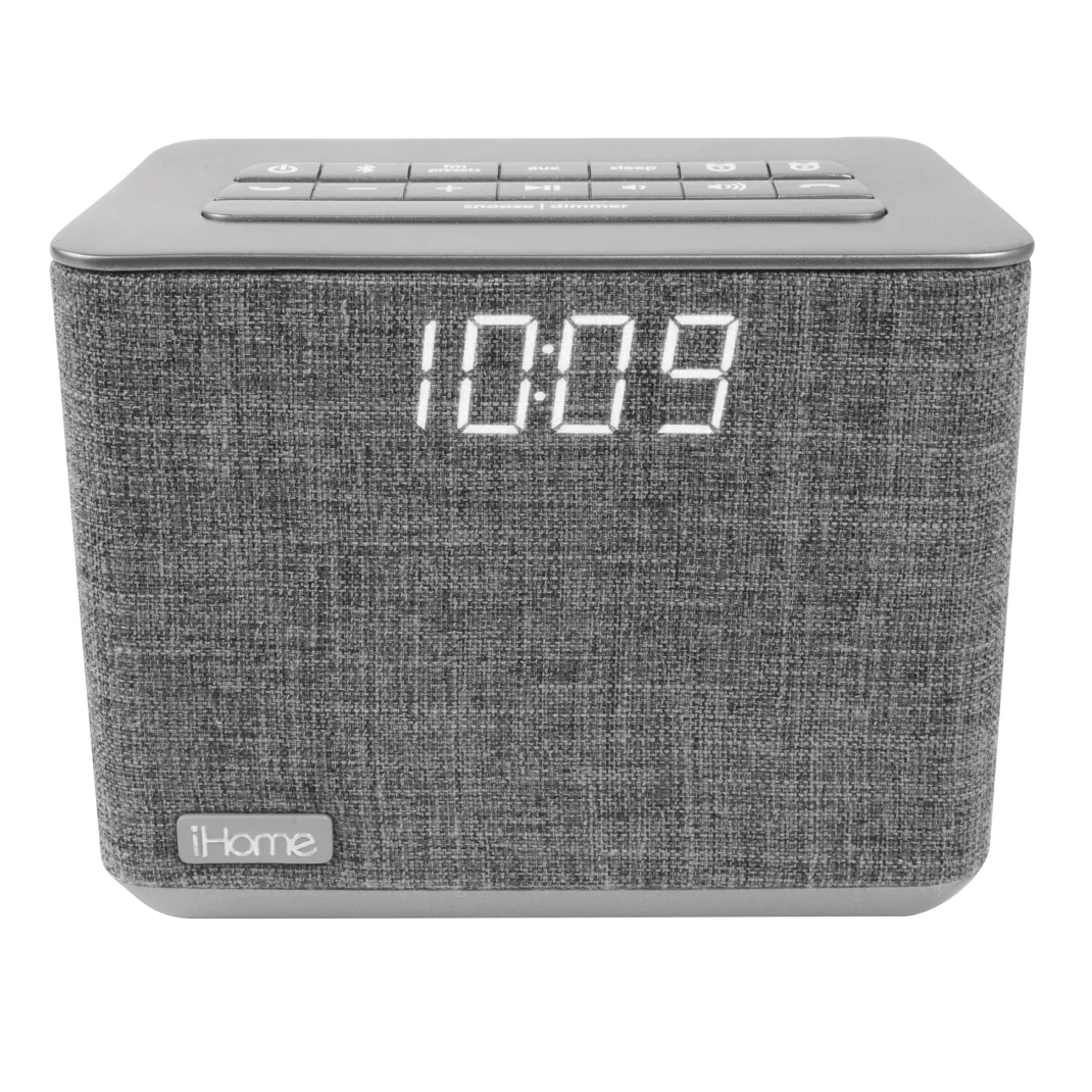 This is an iHome device serving as a clock with a digital display, alarm, and built-in charger, featuring a fabric exterior.