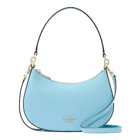 A light blue Kate Spade shoulder bag with gold-tone hardware, featuring a detachable strap and a curved design.
