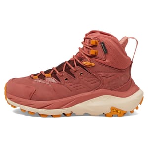 Hoka Kaha 2 Gore-Tex Boots are high-top hiking boots in a rust color, featuring durable waterproof Gore-Tex material, cushioned midsoles, and Vibram soles for enhanced traction.