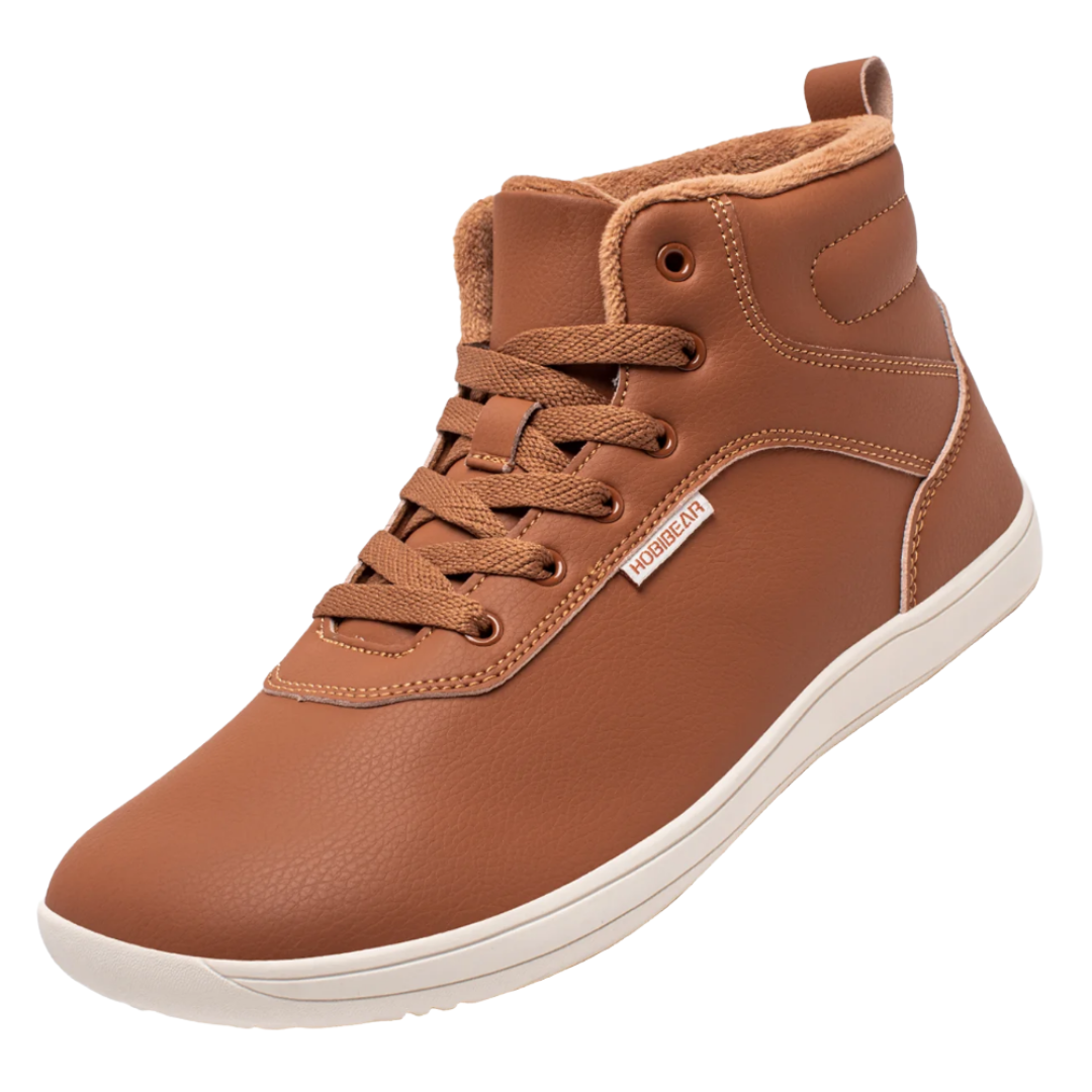 Light brown high-top sneaker with beige lining, textured laces, and a white sole. The side features a small tag with branding.
