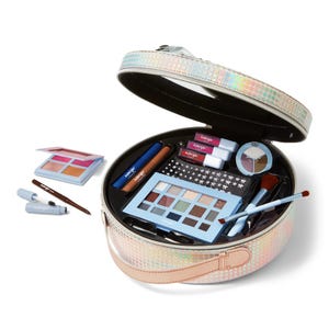 A colorful holographic makeup case opens to reveal an array of beauty products, including eyeshadow palettes, lipsticks, brushes, and other makeup items.
