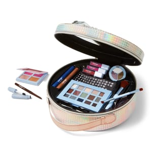 A colorful holographic makeup case opens to reveal an array of beauty products, including eyeshadow palettes, lipsticks, brushes, and other makeup items.