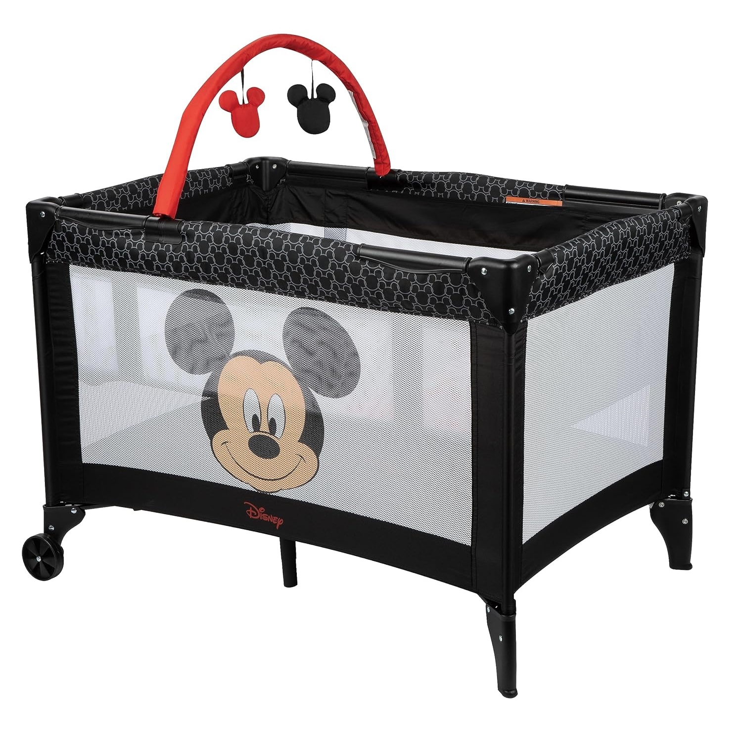 Disney-themed bassinet featuring a black and red design, adorned with a Mickey Mouse motif on the mesh side and hanging Mickey head decorations on a red arch.