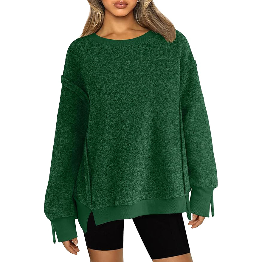A dark green, oversized fleece pullover with dropped shoulders, long sleeves, and a crew neck, paired with black shorts.