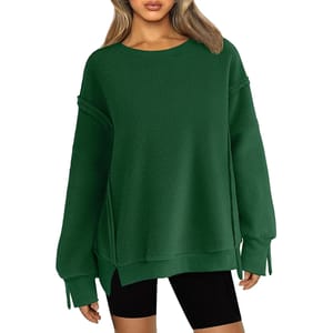 A dark green, oversized fleece pullover with dropped shoulders, long sleeves, and a crew neck, paired with black shorts.