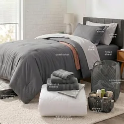 The image shows a neatly arranged bed with a comforter, flat and fitted sheets, pillowcases, a pillow sham, under-bed storage, a collapsible hamper, a shower caddy, a waterproof mattress pad, and a set of three towels.