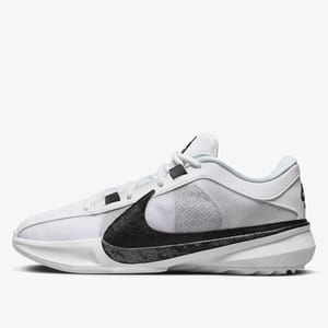 White Nike Giannis Freak 5 shoes with a black Nike swoosh and a geometric pattern on the heel area. They feature a mid-top design and black accents.
