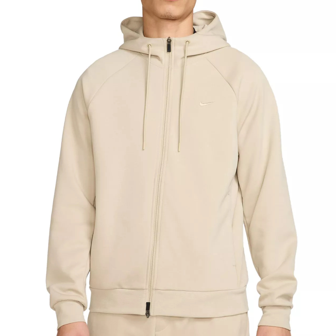 A beige full-zip hoodie with a small logo on the chest, featuring a hood with drawstrings and ribbed cuffs and hem.