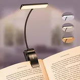 LED book light with adjustable neck and clip, featuring three color temperature settings for reading.
