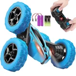 A blue remote-controlled stunt car with large treaded wheels is shown alongside two rechargeable batteries and three AA batteries.