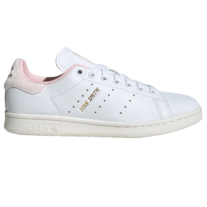 Adidas Stan Smith sneakers in white with a pink heel tab, featuring gold \“Stan Smith\“ text on the side.