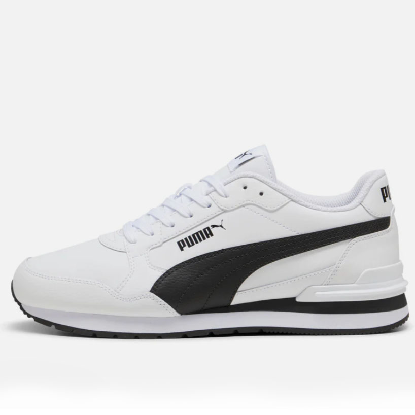 White Puma sneakers with a black side stripe and branding, featuring a mix of smooth upper construction and a chunky sole.
