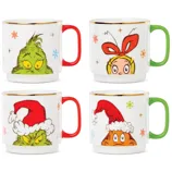 Four ceramic mugs featuring Grinch-themed designs with colorful handles, showcasing characters with Santa hats and holiday motifs.