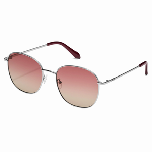 Quay Jezabell Sunglasses feature round, silver metal frames with gradient pink lenses. The arms have burgundy tips, offering a stylish and modern look.