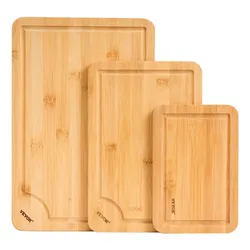 Set of three bamboo cutting boards with grooves; sizes vary from large to small.