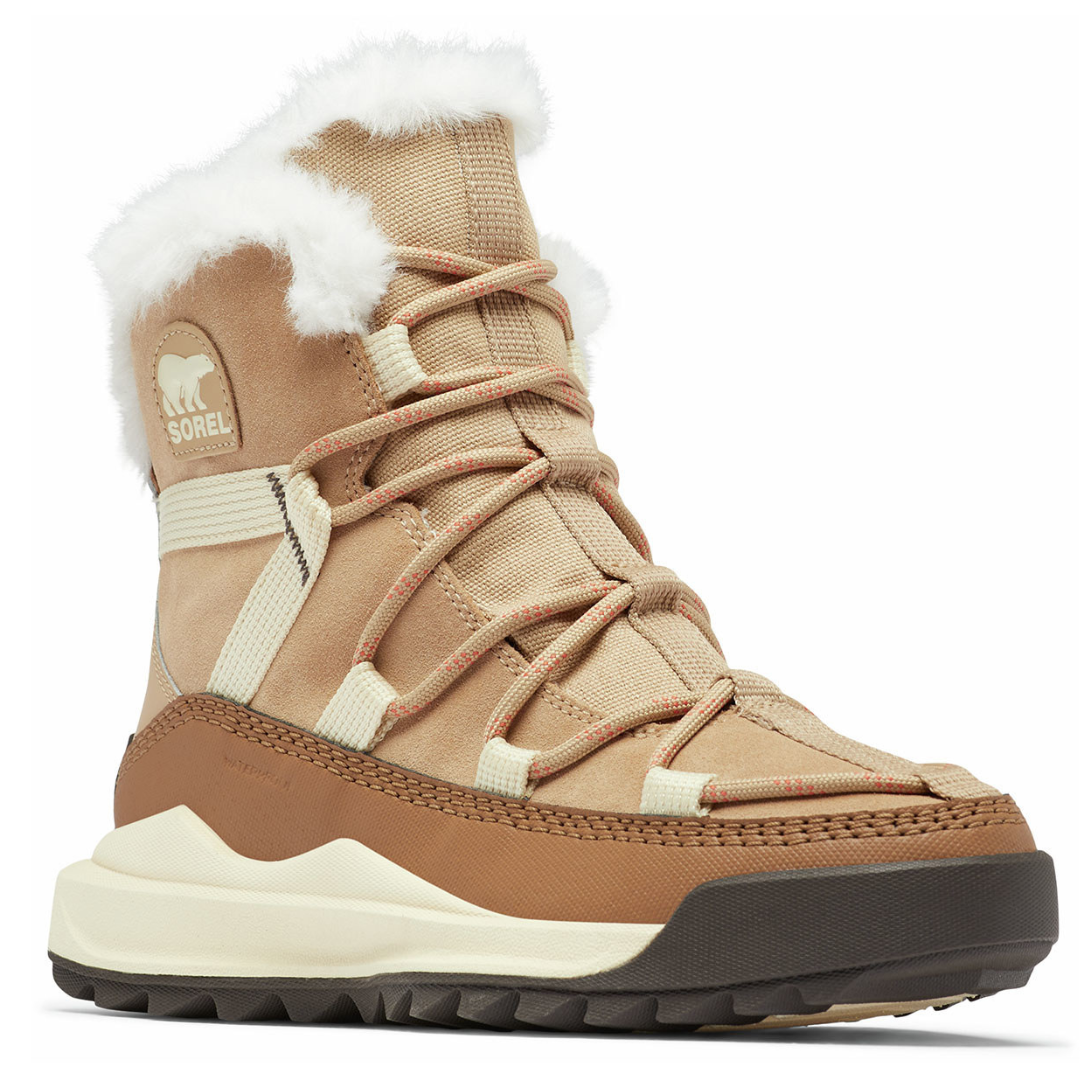 A tan and brown lace-up winter boot with a fluffy white lining, featuring a rugged sole and a logo with a bear design.