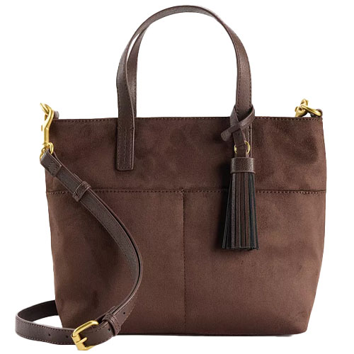 A brown leather handbag with dual handles and a detachable shoulder strap, featuring a tassel accessory and gold-toned hardware.