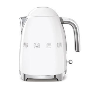 A white Smeg electric kettle with a retro design, featuring chrome accents and a prominent handle. The brand name \“SMEG\“ is displayed on the body.