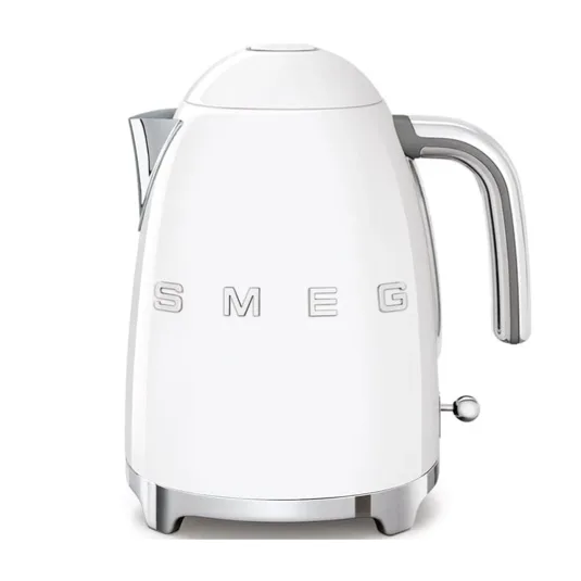 A white Smeg electric kettle with a retro design, featuring chrome accents and a prominent handle. The brand name \“SMEG\“ is displayed on the body.