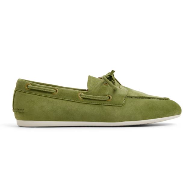 Green suede Sperry Slim Boat Shoes featuring a classic moccasin design, brown leather lacing, and white rubber soles for a casual, nautical look.