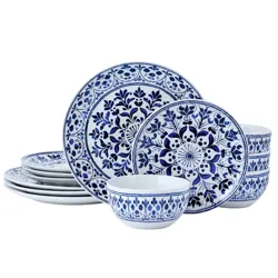 A set of blue and white porcelain dinnerware featuring intricate floral and geometric patterns, including plates and bowls.