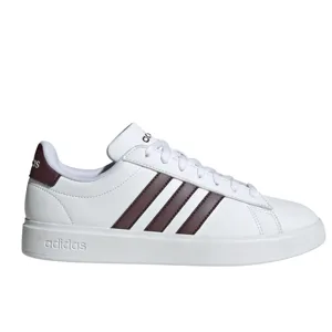 White Adidas sneaker with brown stripes and branding on the heel and tongue, featuring a clean, minimalist design.