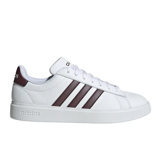 White Adidas sneaker with brown stripes and branding on the heel and tongue, featuring a clean, minimalist design.