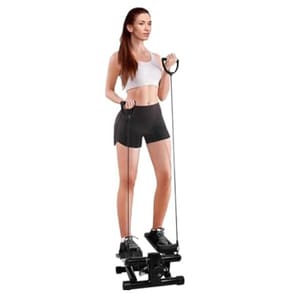 Mini stair stepper machine with resistance bands, designed for low-impact aerobic exercise and toning, featuring a compact, portable design with adjustable settings for varying workout intensities, shown in use by a person wearing workout attire.