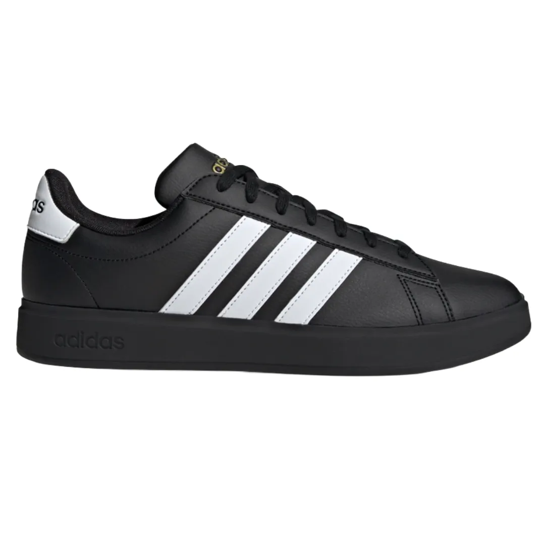 A black Adidas sneaker with three white stripes on the side, featuring a black sole and black laces.