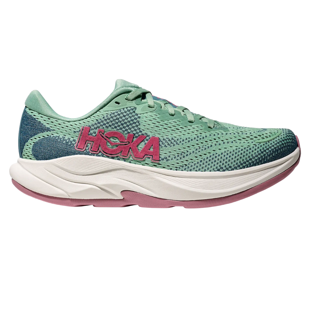 A green and blue Hoka running shoe with a pink logo, featuring a cushioned white midsole and pink outsole.
