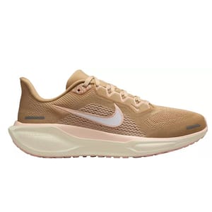 A beige Nike running shoe with a white swoosh logo, featuring a mesh upper and cushioned sole.