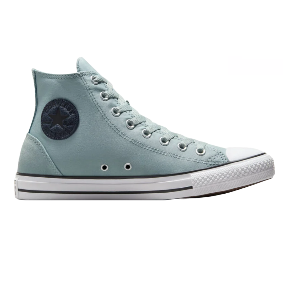 Converse Chuck Taylor High Tops in light blue feature a canvas upper, signature star patch on the ankle, white rubber toe cap, and a vulcanized rubber sole with black stripe detailing.