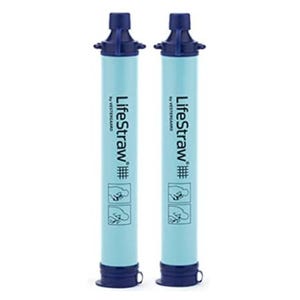 Two blue LifeStraw Personal Water Filters with dark blue caps, designed for outdoor or emergency use to purify drinking water. Each filter has instructions depicted on the sides.