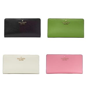 Four rectangular wallets in black, green, ivory, and pink, each with the Kate Spade logo.