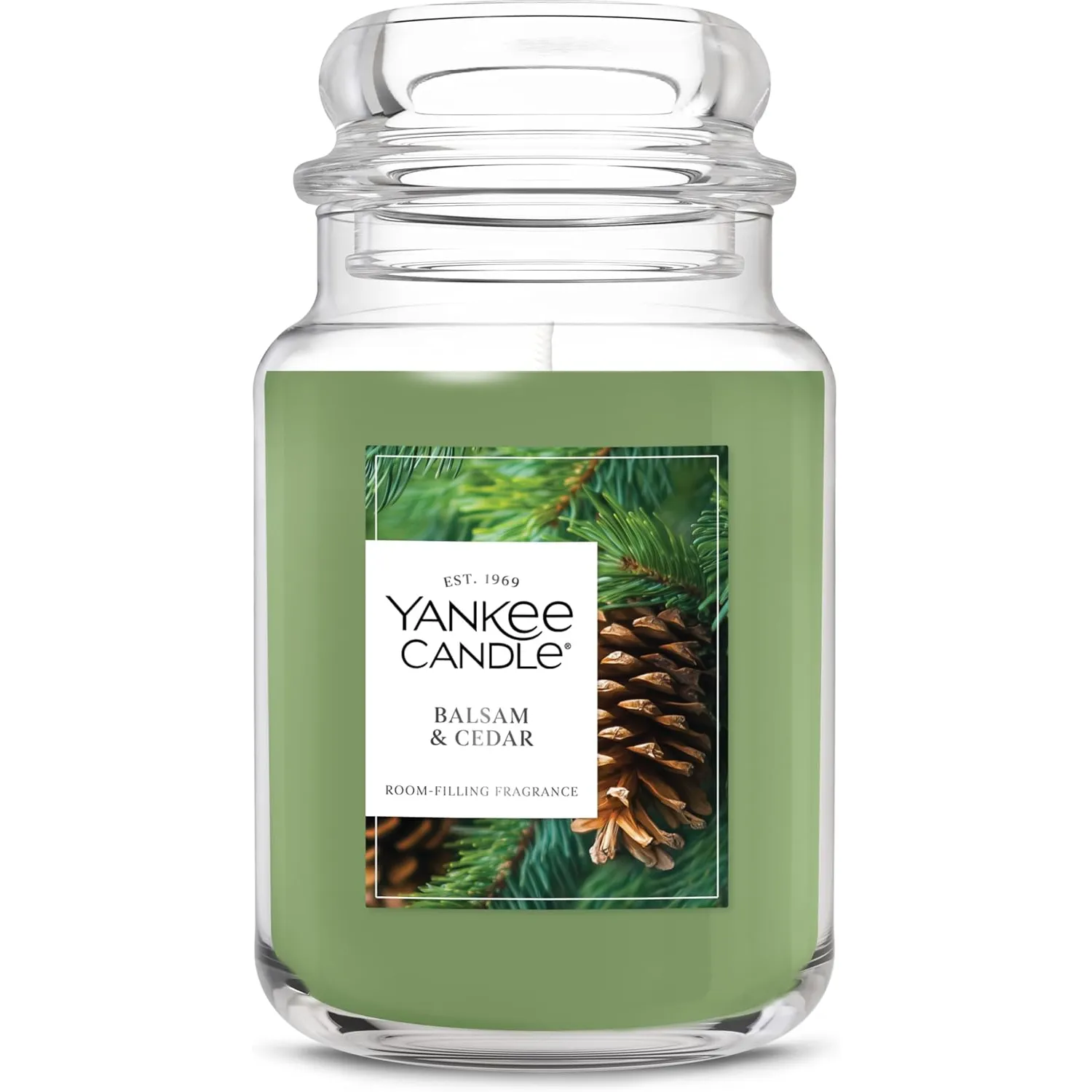 Yankee Candle jar in Balsam & Cedar scent, featuring a room-filling fragrance and a green appearance with pine imagery on the label.