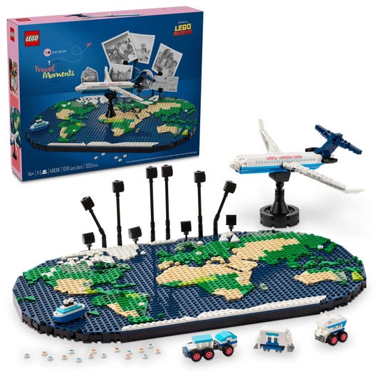 LEGO Travel Moments set featuring a world map display with location markers, a plane on a stand, a cruise ship, and ground vehicles. Contains 1231 pieces and is suitable for ages 14 and up.