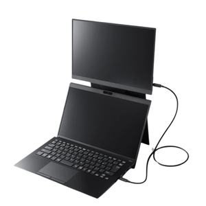 A compact, dual-screen laptop setup with an external monitor connected via a cable, positioned above the laptop.